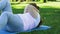 Fat girl hardly doing push-up, lying on mat in park, exhausted workout, dieting