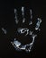 Fat human hand imprint on black, vertical photo