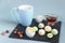 Fat keto peanut butter, cheesecake, matcha balls and keto matcha coconut bulletproof tea in blue cup. keto protein balls and