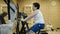 Fat little boy workout exercise bike in fitness room. concept healthy lifestyle