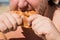 Fat man on the beach eating a pie