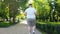 Fat man jogging in park, weight loss program, healthy lifestyle, back view