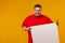 Fat man in red t-shirt displaying a white banner ad isolated over a yellow background.