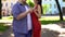 Fat man and slim female dancing in park, romantic date, inner beauty in priority