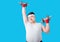 Fat people, Young men are overweight are exercising by lifting dumbbells