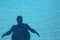 Fat shadow in the swimming pool as sedentary