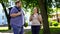 Fat university students talking and smiling, romantic date in park, friendship