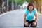 Fat woman feeling tired while running in the park