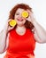 The fat woman with orange juice vegetable fruit holding isolated