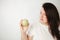 Fat woman snacking with fruits. Eat healthy