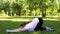 Fat woman stretching after exercising at park, active healthy lifestyle, nature