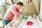 Father admiring how newborn baby sleeping in crib