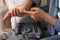 Father applying ointment onto his daughter\'s elbow on couch, closeup