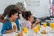 Father in army uniform and african american kids eating breakfast