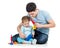 Father and baby boy having fun with musical toys