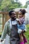 Father with beard holding his Daughter in his arms looking at him with love in rainy