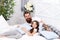 Father bearded man with funny hairstyle ponytails and daughter in pajamas. Having fun pajamas party. Slumber party