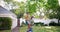 Father, black child and swing at backyard, happy at home and bonding together. Dad push kid on rope, play outdoor at