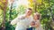 Father blowing soap bubbles and little daughter catches them in the park, lifestyle family concept