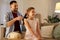 Father brushing daughter hair at home