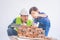 Father builder teaching his son to lay the brick wall for future career and education for family and parenting concept