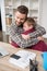 Father businessman hugs his son