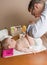 Father changing diaper of adorable baby