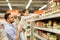 Father with child buying food at grocery store