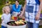 Father and child grilling food