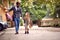 Father and child holding hands going to school