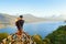 Father with child look at amazing tropical lake in mountains