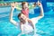 Father and child in resort swimming pool