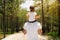 Father and child taking a walk together in a park outside. Green forest background