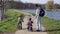 Father and children cycling