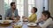 Father, children and eating breakfast in kitchen for morning nutrition, pancakes or connection. Man, son and daughter