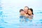 Father with children enjoying the swimming pool