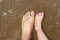 Father and children feet on summer sand beach