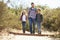 Father And Children Hiking In Countryside