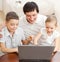 Father with children with laptop