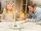 Father and children lighting the hanukkah menorah together