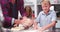 Father And Children Making Pizza In Kitchen Together