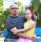 Father with children in park, happy family portrait, two peoples sit on bench, parenting concept