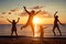 Father and children playing on the beach at the sunset time.