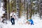 Father and children playing in snow