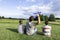 Father and children playing with toy airplane at sunny summer day. Family engaged in game together and having fun