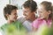 Father With Children Smiling At Home