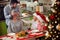 father and children surprises mother with family Christmas dinner.