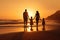 Father and children walking on the beach at sunset. Concept of friendly family, rear view of A happy family in walks hand in hand