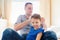 Father combing hair of his daughter in the morning