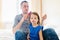 Father combing hair of his daughter in the morning